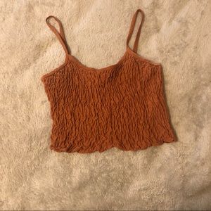 slightly dark orange ruffled croptop